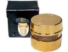 Crismera de metal dourado com caixa de pele