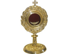 Relicário - custódia de metal dourado com decoração em relevo